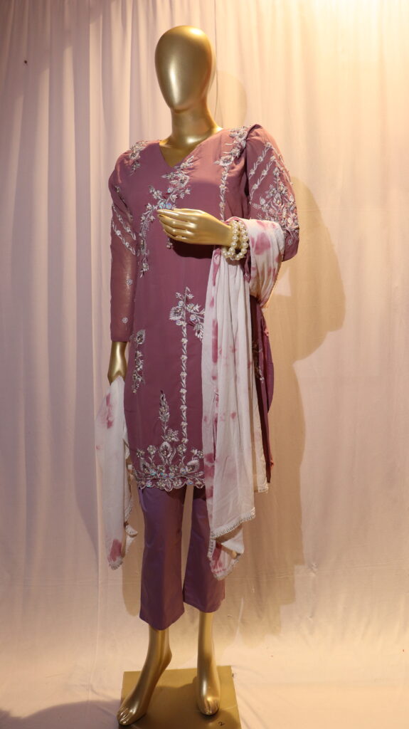 mannequin wearing heavy Persian pink colour embroidery suit with tie and dye dupatta and Persian pink pant