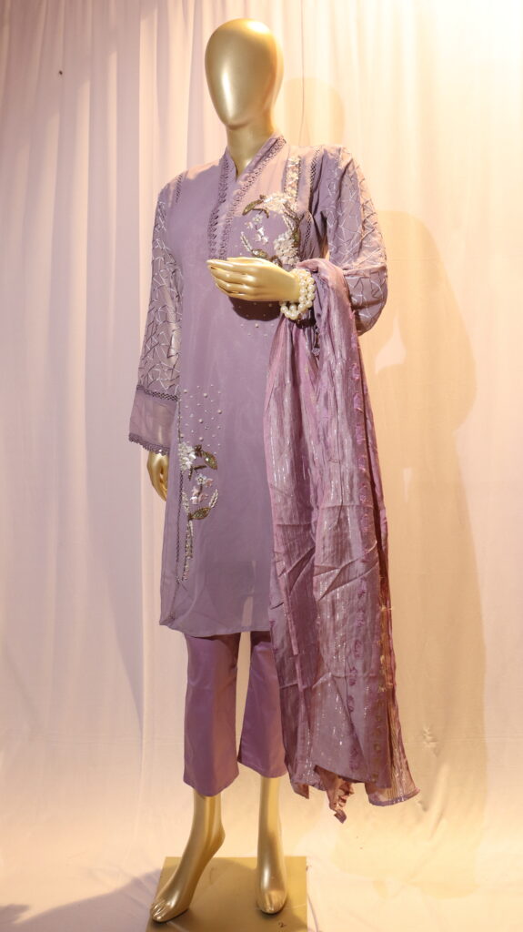 mannequin wearing purple monochrome suit which has hand embroidery on the top