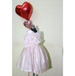 Mannequin wearing pearl color baby girl clothing frock