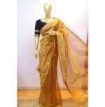 "Golden tissue silk saree with a shimmering gold border, paired with a contrasting black blouse featuring intricate sleeve detailing, perfect for festive occasions."